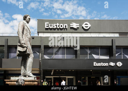 Statue of railway engineer Robert Stephenson, by Carlo Marochetti, in front of the entrance to Euston Station, Euston, London, UK Stock Photo