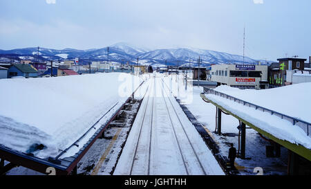 Yoichi, Japan - Feb 4, 2015. People waiting at railway station in Yoichi, Hokkaido, Japan. Yoichi is the home of the Yoichi distillery owned by Nikka  Stock Photo