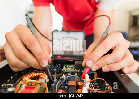 REPAIRING ELECTRONICS WITH TEST EQUIPMENT Stock Photo