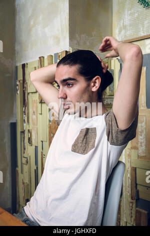 Portrait of a man looking out in a cafe window. Stock Photo