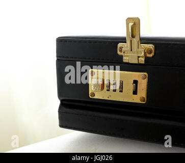 Combination lock on an old briefcase Stock Photo