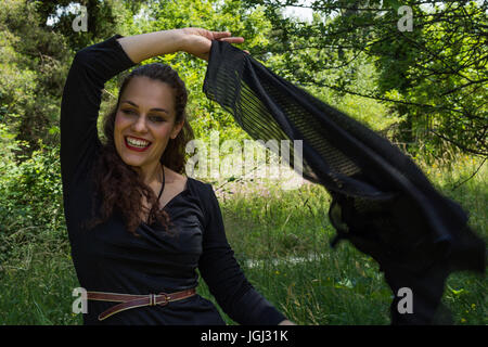 Woman in dark dress Stock Photo