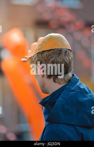 Blonde, young male having fun on King's Day in Groningen, Netherlands Stock Photo