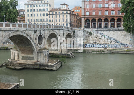 Graffiti mars embankment at 15th century Ponte Sisto on Tiber River in Rome, a city filled with graffiti, tourists and residents. May 2017 Stock Photo
