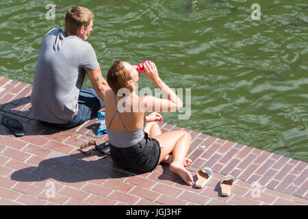 A couple lost in separate thought in London, England, UK Stock Photo