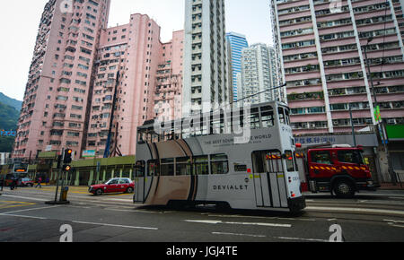 Hong Kong - Mar 29, 2017. Vehicles on street at Causeway Bay in Hong Kong, China. Hong Kong is an important hub in East Asia with global connections t Stock Photo