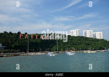 PATTAYA, THAILAND - 22 NOV, 2016: Pattaya bay with commerical boats and the Pattaya City sign on the hill Stock Photo