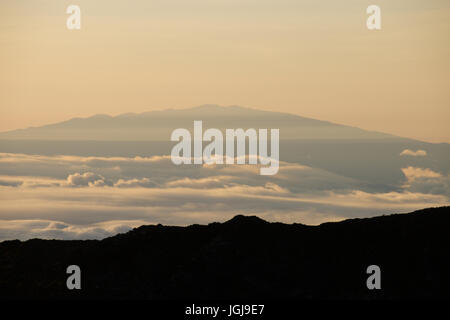 Mauna Kea seen from Haleakala Crater at Sunrise Stock Photo