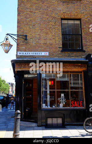 A shop in Wilkes Street in Shoreditch, in the East End of London.  The shop has a sale on. Stock Photo