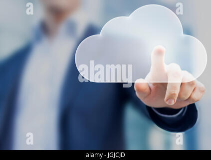 Cloud computing concept with a person touching a virtual digital icon Stock Photo