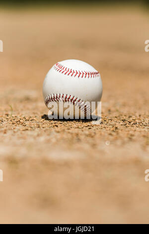 Baseball on the infield dirt of a ball field Stock Photo