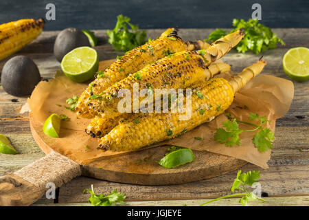 Barbecued Homemade Elote Mexican Street Corn with Mayo and Chili Powder Stock Photo