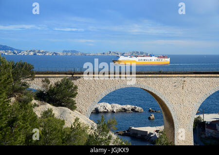 A Ferry Boat Sails Past the Railway Viaduct at La Vesse Calanque on the Mediterranean Coast La Côte Bleue or Blue Coast west of Marseille France Stock Photo