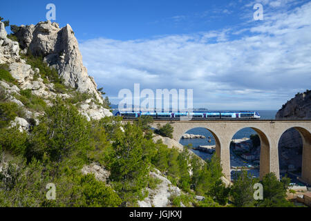 Local or Regional Train Crossing Railway Viaduct at La Vesse Calanque on the Mediterranean La Côte Bleue or Blue Coast west of Marseille France Stock Photo