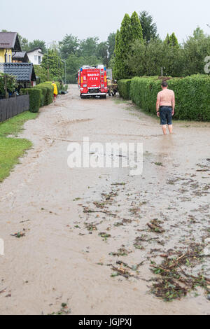 Slovenska Bistrica, Slovenia. 7th Jul, 2017. Floods hit the town Slovenska Bistrica in Slovenia after heavy rain. Several houses and shops were flooded while emergency services and firefighters rushed to relieve the affected owners. Worried property owners rush to save their belongings in an effort to stop the flood waters. Credit: Andrej Safaric/Alamy Live News Stock Photo