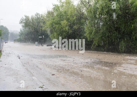 Slovenska Bistrica, Slovenia. 7th Jul, 2017. Floods hit the town Slovenska Bistrica in Slovenia after heavy rain. Several houses and shops were flooded while emergency services and firefighters rushed to relieve the affected owners. Worried property owners rush to save their belongings in an effort to stop the flood waters. Credit: Andrej Safaric/Alamy Live News Stock Photo