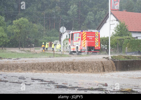 Slovenska Bistrica, Slovenia. 7th Jul, 2017. Floods hit the town Slovenska Bistrica in Slovenia after heavy rain. Several houses and shops were flooded while emergency services and firefighters rushed to relieve the affected owners. Worried property owners rush to save their belongings in an effort to stop the flood waters. Credit: Andrej Safaric/Alamy Live News Stock Photo