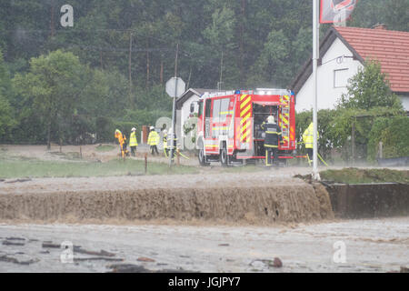 Slovenska Bistrica, Slovenia. 7th Jul, 2017. Floods hit the town Slovenska Bistrica in Slovenia after heavy rain. Several houses and shops were flooded while emergency services and firefighters rushed to relieve the affected owners. Worried property owners rush to save their belongings in an effort to stop the flood waters. Credit: Andrej Safaric/Alamy Live News Stock Photo