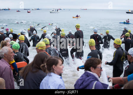 Wales Swim 2017, Tenby, Pembrokeshire, West Wales, UK. This years swim includes entries for 5000 amateur and professional athletes from 50 countries on a 1.2 mile or 2.4 mile swim, depending on entry level, around the North Beach. Athletes are competing for the Long Course Weekend Champion. Credit: Andrew Bartlett/Alamy Live News Stock Photo