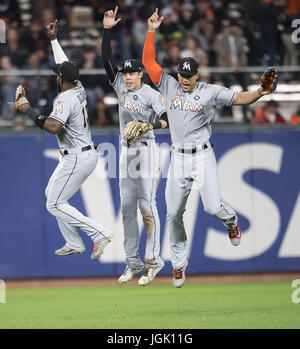 San Francisco, California, USA. 07th July, 2017. Miami Marlins left fielder Marcell Ozuna (13), center fielder Christian Yelich (21), and right fielder Giancarlo Stanton (27) celebrate their 6-1 victory, following the MLB baseball game between the Miami Marlins and the San Francisco Giants at AT&T Park in San Francisco, California. Valerie Shoaps/CSM/Alamy Live News Stock Photo