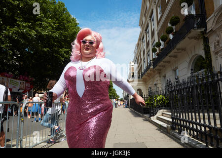 London Pride 2017 - transgender man walking down the street in pink dress Stock Photo
