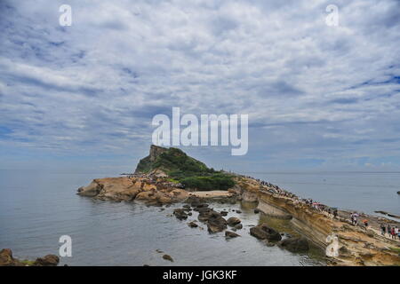 (170708) -- TAIPEI, July 8, 2017 (Xinhua) -- Tourists enjoy scenery at Yehliu Geopark in New Taipei City, southeast China's Taiwan, July 8, 2017. (Xinhua/Zhou Mi) (lfj) Stock Photo