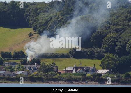 Fire Smoke Plume from the Burning of Farm Waste. Exe Estuary, Devon, UK. July, 2017. Stock Photo