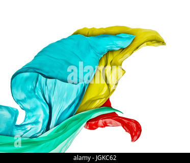 Smooth elegant colored cloth separated on white background. Texture of flying fabric. Stock Photo