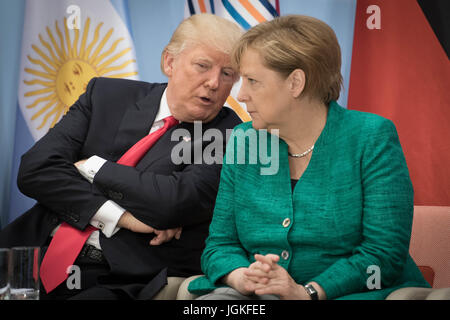 US President Donald Trump and German Chancellor Angela Merkel attend the launch of the World Bank's Women's Entrepreneurship Facility Initiative on the margins of the G20 summit in Hamburg. Stock Photo