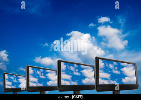 computer monitors in the sky, data storage in the cloud and cloud computing concept Stock Photo