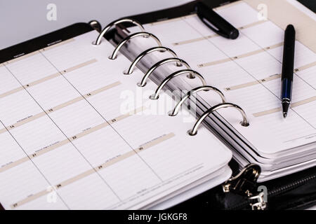 luxury executive leather personal organizer or planner on white background Stock Photo