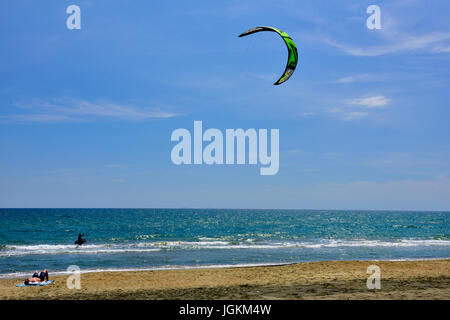 Kite surfing at 'Windy Beach', on the Mediterranean Sea at Salto Covino, Italy with near constant thermal wind Stock Photo