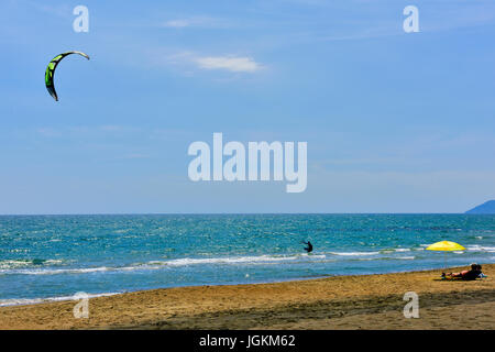 Kite surfing at 'Windy Beach', on the Mediterranean Sea at Salto Covino, Italy with near constant thermal wind Stock Photo