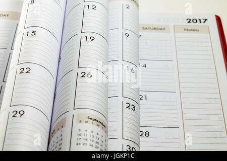 United States; 2017 Blurred and focused desk calendar with pages that are folded that can be useful for denoting time past; span of time, agenda. Stock Photo