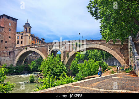 The Pons Fabricius (Italian: Ponte Fabricio, meaning 'Fabricius' Bridge') or Ponte dei Quattro Capi, is the oldest Roman bridge in Rome, Italy Stock Photo