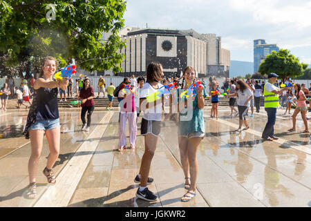 Sofia, Bulgaria - 8 July 2017: Children and adults participate in a fight with water guns and other water spray equipment in the center of Sofia. Stock Photo