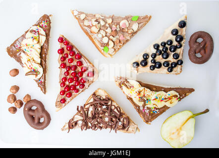 Sweet triangle sandwiches with fruit and cream Stock Photo