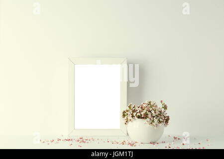 empty picture frame, decorated with small pink flowers and vintage style, white background Stock Photo