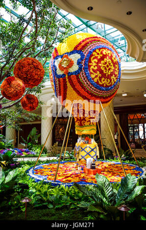 Las Vegas, USA - May 7, 2014: Wynn hotel decorated with rose flowers and hot air balloon inside mall in Nevada Stock Photo