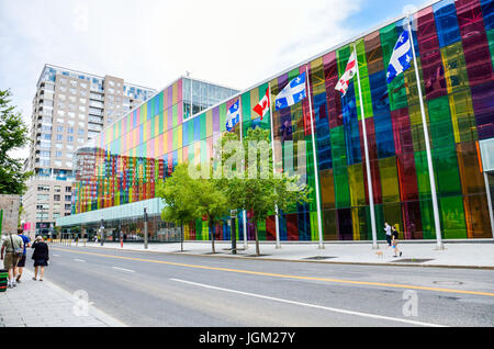 Montreal, Canada - July 26, 2014: Palais des congres convention center colorful multicolored building in downtown old town of city with flags Stock Photo