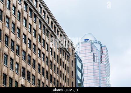 Montreal, Canada - May 26, 2017: KPMG sign and modern skyscraper glass building in downtown area of city in Quebec region Stock Photo