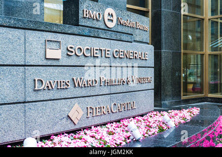 Montreal, Canada - May 26, 2017: Financial companies building entrance with signs in downtown area in Quebec region Stock Photo