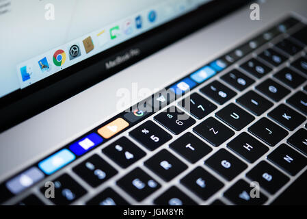 Backlit keyboard and Touch Bar showing websites, laptop, Apple MacBook Pro, close-up Stock Photo