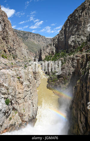 CODY, WYOMING - JUNE 24, 2017: Buffalo Bill Dam water discharge and rainbows. The dam on the Shoshone River is named after the famous wild west figure Stock Photo