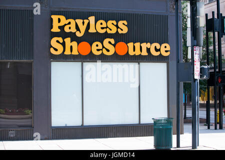 A logo sign outside of a shuttered Payless ShoeSource Inc., retail store in Cincinnati, Ohio on June 29, 2017. Stock Photo