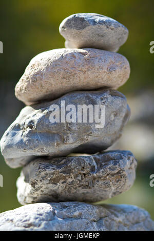Stacked river stones in the running through, Austria, Lower Austria, nature reserve ?tscher Torm?uer - Stacked stones At Running through river, Austri Stock Photo