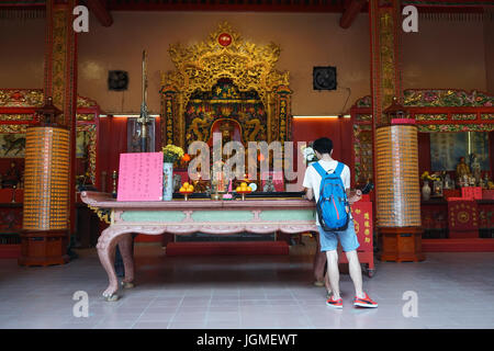 Kuala Lumpur, Malaysia - Jun 6, 2015. People praying at Chinese temple in Chinatown, Kuala Lumpur, Malaysia. Stock Photo