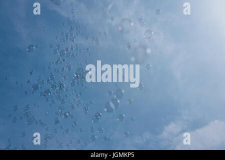 soap bubbles against blue sky Stock Photo