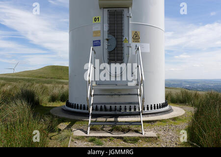 Steel access door, steps and anchor bolts at base of Wind turbine at scout moor wind farm in rochdale north west england uk Stock Photo