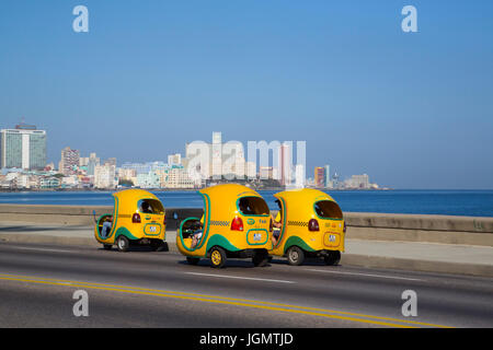 Coco Taxis on the Malecon, Centro Habana, Havana, Cuba Stock Photo